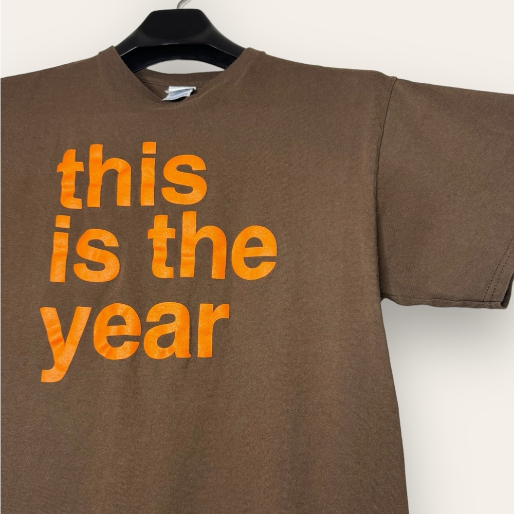 “This is the year” Orange Graphic Brown Tee
Tagged L